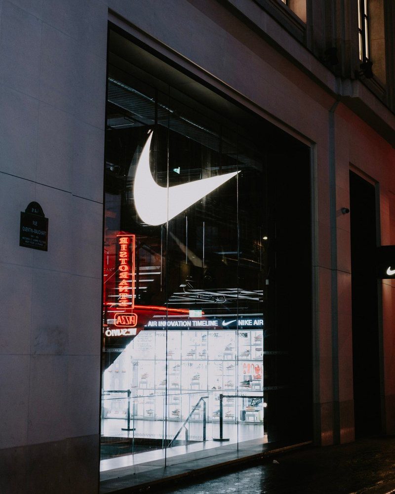 A brand storefront lit at night