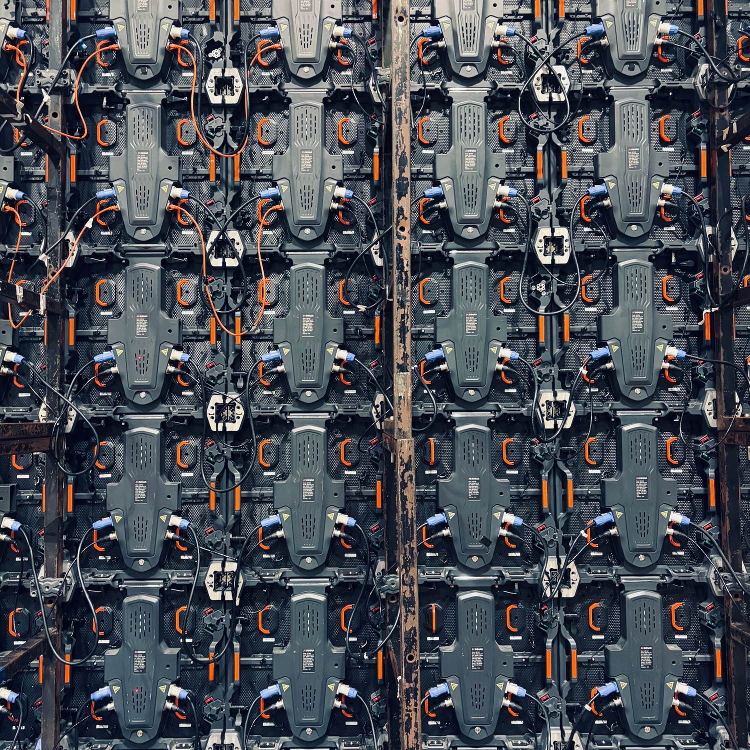 A dense rack of equipment panels, cabled and labelled