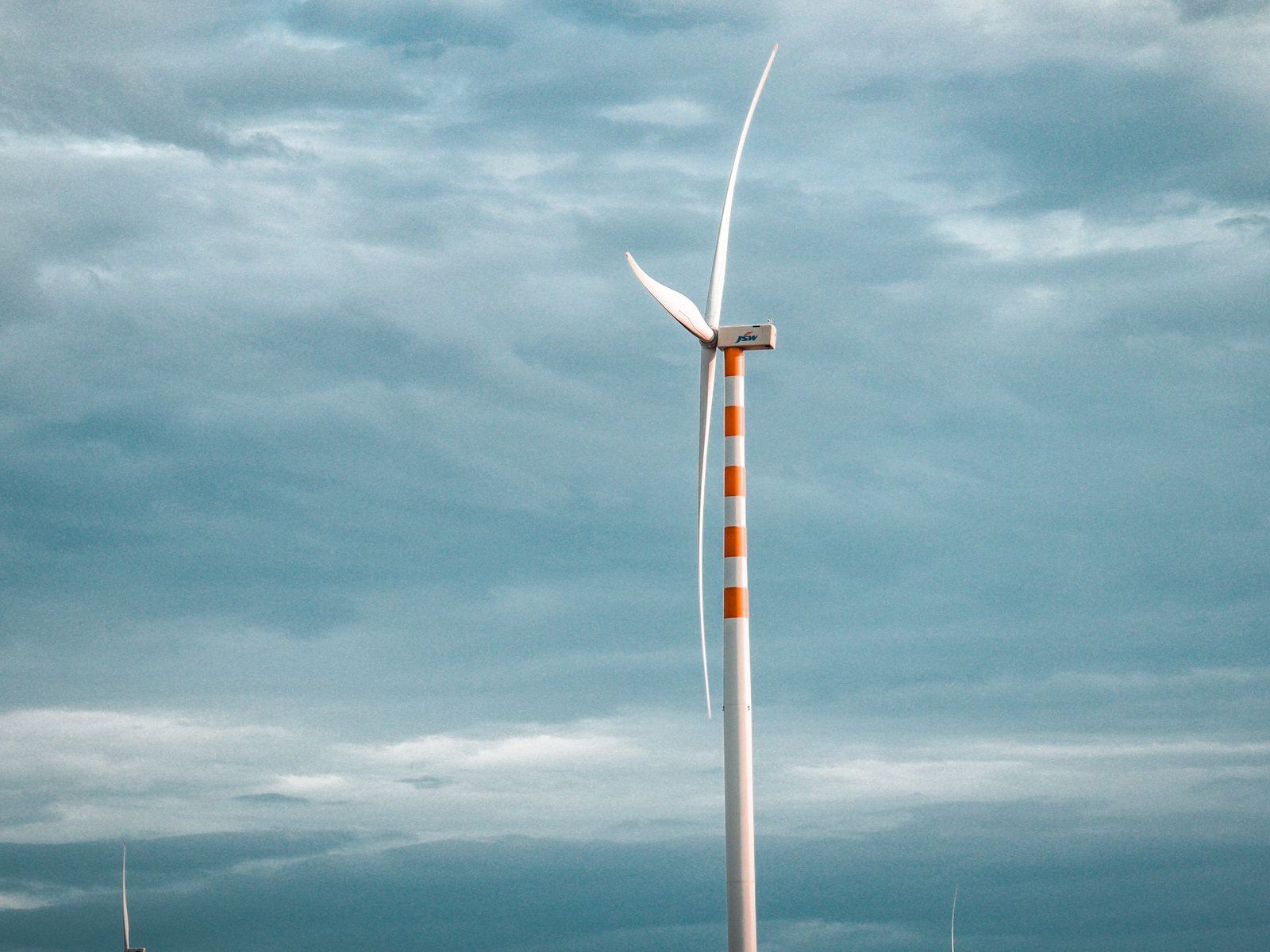 A wind turbine against an overcast sky